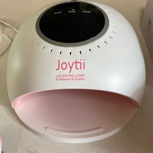 Gel nail kit - like new! Comes with 32 original polishes and more!